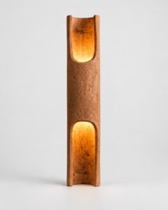 Vessel II terracotta lamp with glowing openings by Hilykan